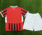 Dziecięcy zestaw piłkarski AC Milan home 24/25 Puma (koszulka+spodenki)